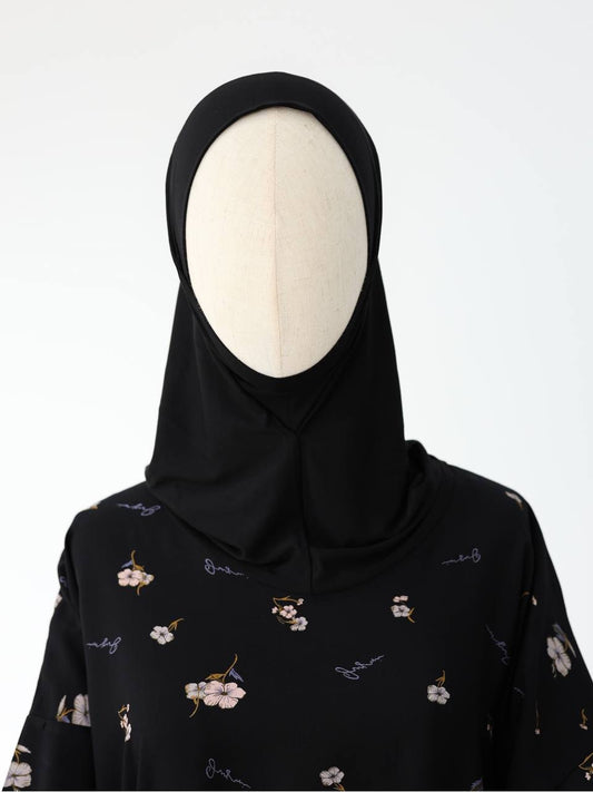 Oberkörperansicht des Jawhara Kleides – dezente Eleganz mit stilvollem Kragen und fallendem Stoff.